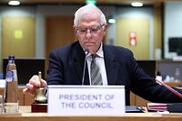 European Union High Representative for Foreign Affairs and Security Policy Josep Borrell rings the bell at the start of a Foreign Affairs Council (FAC) meeting at the EU headquarters in Brussels on March 21, 2022. (Photo by Kenzo TRIBOUILLARD / AFP)