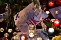 (FILES) In this file photo taken on July 15, 2016 in Nice shows a message reading "I am Nice" placed at a make-shift memorial for victims of the deadly Bastille Day attack in Nice. (Photo by GIUSEPPE CACACE / AFP)