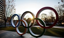 (FILES) In this file photo taken on March 25, 2020 the Olympic Rings are pictured in front of the Japan National Stadium, the main venue for the Tokyo 2020 Olympic Games, in Tokyo. (Photo by Behrouz MEHRI / AFP)