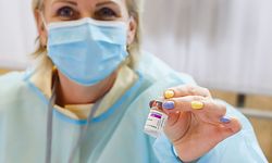 A medical worker holds a vial of the AstraZeneca vaccine against the coronavirus (Covid-19) at the Northern Kurzeme Regional Hospital in Ventspils, Latvia, on March 30, 2021. (Photo by Gints Ivuskans / AFP)