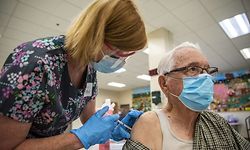SAN ANTONIO, TX - MARCH 29: Rene Neira receives his Moderna COVID-19 vaccine at a vaccination site at a senior center on March 29, 2021 in San Antonio, Texas. Texas has opened up all vaccination eligibility to all adults starting today. Texas has had a slower roll out than some states and with the increase in eligibility leaders are hoping more and more citizens get vaccinated.   Sergio Flores/Getty Images/AFP
== FOR NEWSPAPERS, INTERNET, TELCOS & TELEVISION USE ONLY ==