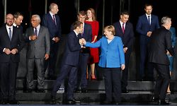 TOPSHOT - France's President Emmanuel Macron (CL), Germany's Chancellor Angela Merkel (CR), Eu members states and Western Balkans partners' representants pose as they arrive at the EU-Western Balkans summit at Brdo Castle in Kranj on October 5, 2021. - EU leaders will have a hard discussion on Europe's place in the world at a summit, as they seek unity on how to deal with superpowers China and the United States. The 27 heads of state and government will meet at Brdo Castle in Slovenia, the country that currently holds the EU's rotating presidency. (Photo by Ludovic MARIN / AFP)