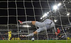 Chelsea's Spanish goalkeeper Kepa Arrizabalaga dives to save the penalty of Villarreal's Spanish defender Raul Albiol (L) to win the penalty shoot out and win the presentation ceremony after Chelsea won the UEFA Super Cup football match between Chelsea and Villarreal at Windsor Park in Belfast on August 11, 2021. (Photo by Paul ELLIS / AFP)