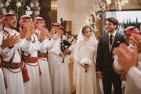 A handout picture released by Jordan's Royal Palace shows the wedding ceremony of the Jordanian monarch's eldest daughter Princess Iman and Jameel Alexander Thermiotis in Amman on March 12, 2023. - Thermiotis, who was born in 1994 in Venezuela to a family of Greek origin, currently works in the field of finance in New York. (Photo by Jordanian Royal Palace / AFP) / RESTRICTED TO EDITORIAL USE - MANDATORY CREDIT "AFP PHOTO / JORDANIAN ROYAL PALACE" - NO MARKETING NO ADVERTISING CAMPAIGNS - DISTRIBUTED AS A SERVICE TO CLIENTS