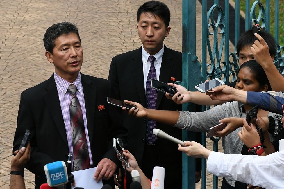 Former North Korean deputy ambassador to the United Nations Ri Tong Il (L) addresses journalists outside the North Korean embassy in Kuala Lumpur on March 2, 2017.