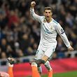 Real Madrid's Portuguese forward Cristiano Ronaldo celebrates after scoring his second goal during the UEFA Champions League round of sixteen first leg football match Real Madrid CF against Paris Saint-Germain (PSG) at the Santiago Bernabeu stadium in Madrid on February 14, 2018.   / AFP PHOTO / GABRIEL BOUYS
