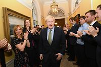 Britain's Prime Minister and Conservative Party leader Boris Johnson is greeted by staff as he arrives back at 10 Downing Street in central London on December 13, 2019, following an audience with Britain's Queen Elizabeth II at Buckingham Palace, where she invited him to become Prime Minister and form a new government. - Conservative Prime Minister Boris Johnson on Friday hailed a political "earthquake" in Britain after a thumping election victory which clears the way for the country to finally leave the EU next month after years of paralysing deadlock. (Photo by Stefan Rousseau / POOL / AFP)