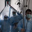 HOUSTON, TX - NOVEMBER 16: Medical staff enter the COVID-19 intensive care unit (ICU) at United Memorial Medical Center on November 16, 2020 in Houston, Texas. Texas has recorded more than 1.1 million cases of the disease, with more than 20,000 deaths.   Go Nakamura/Getty Images/AFP
== FOR NEWSPAPERS, INTERNET, TELCOS & TELEVISION USE ONLY ==