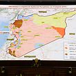 Russia's senior military officer Sergei Rudskoi sits bellow a map of Syria screened during a briefing at the Russian Defence Ministry headquarters in Moscow on April 14, 2018, following overnight joint strikes by the US, Britain and France in Syria.
The Russian military said on April 14, 2018 that Western allies fired 103 cruise missiles including Tomahawk missiles at Syria but that Syrian air defence systems managed to intercept 71 of them. The US, Britain and France conducted joint strikes overnight on April 14 against the Syrian regime of Bashar al-Assad in response to alleged chemical weapons attacks. / AFP PHOTO / Kirill KUDRYAVTSEV