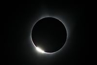 The "diamond ring effect" is seen during a total solar eclipse as seen from the Lowell Observatory Solar Eclipse Experience on August 21, 2017 in Madras, Oregon. 
Millions will be able to witness the total eclipse that will touch land in Oregon on the west coast and continue through South Carolina on the east coast.  / AFP PHOTO / STAN HONDA
