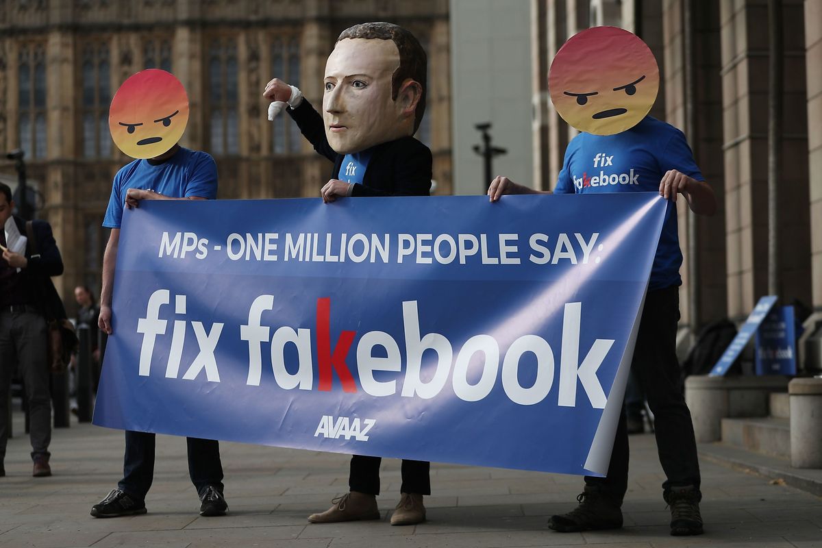 Protestors from the pressure group Avaaz demonstrate outside Portcullis house where Facebook's CTO was questioned by members of parliament in London Photo: AFP