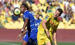 Troyes' Portuguese forward Gerson Rodrigues (L) fights for the ball with Nantes' Brazilian defender Andrei Girotto (R) during the French L1 football match between Nantes (FC Nantes) and  Troyes (ESTAC) at La Beaujoire stadium in Nantes, western France, on October 3, 2021. (Photo by Sebastien SALOM-GOMIS / AFP)