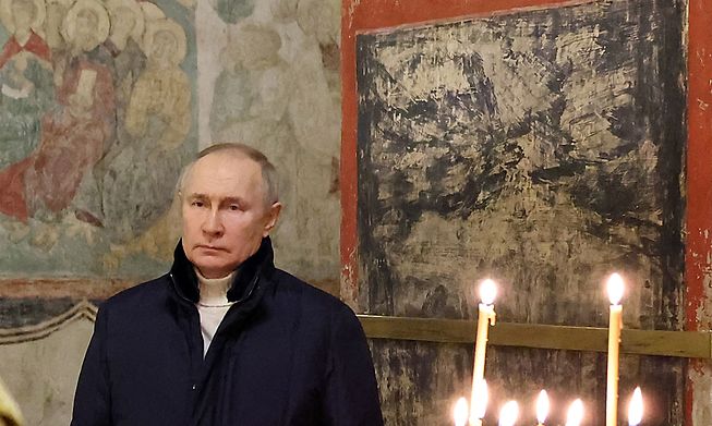 Russian President Vladimir Putin attends an Orthodox Christmas mass in the Cathedral of the Annunciation at the Kremlin in Moscow, late on 6 January, 2023