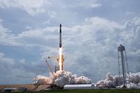 This handout photo released by NASA shows a SpaceX Falcon 9 rocket carrying the company's Crew Dragon spacecraft launched from Launch Complex 39A on NASA�s SpaceX Demo-2 mission to the International Space Station with NASA astronauts Robert Behnken and Douglas Hurley onboard on May 30, 2020, at NASA�s Kennedy Space Center in Florida. - The Demo-2 mission is the first launch with astronauts of the SpaceX Crew Dragon spacecraft and Falcon 9 rocket to the International Space Station as part of the agency�s Commercial Crew Program. The test flight serves as an end-to-end demonstration of SpaceX�s crew transportation system. Behnken and Hurley launched at 3:22 p.m. EDT on Saturday, May 30, from Launch Complex 39A at the Kennedy Space Center. A new era of human spaceflight is set to begin as American astronauts once again launch on an American rocket from American soil to low-Earth orbit for the first time since the conclusion of the Space Shuttle Program in 2011. (Photo by Bill INGALLS / NASA / AFP) / RESTRICTED TO EDITORIAL USE - MANDATORY CREDIT "AFP PHOTO / NASA / BILL INGALLS" - NO MARKETING - NO ADVERTISING CAMPAIGNS - DISTRIBUTED AS A SERVICE TO CLIENTS