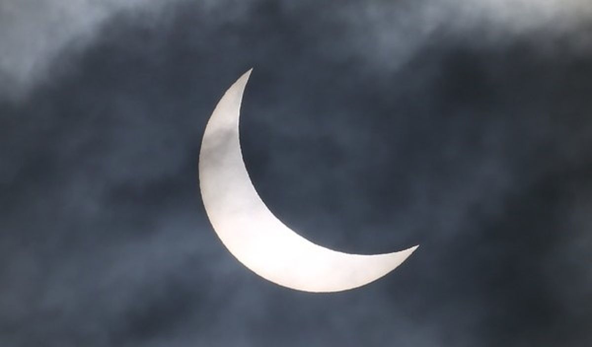 A partial solar eclipse of the sun is visible in Plymouth, south-west England on March 20, 2015. AFP PHOTO / GEOFF CADDICK