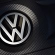 The logo of German car maker Volkswagen (VW) is seen on a VW Golf car in Milton Keynes, north of London, on October 2, 2015. Paris prosecutors have launched a preliminary investigation into possible fraud over the pollution-cheating software installed in diesel engines by German auto giant Volkswagen, a judicial source told AFP on October 2, 2015. AFP PHOTO / FRANCK FIFE
