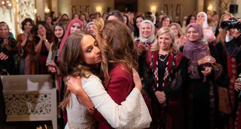 A handout picture released by the Press Service of Jordanian Queen Rania, shows her hugging her daughter Princess Iman bint Abdullah during a henna night ceremony on March 7, 2023 ahead of Princess Iman's upcoming wedding. (Photo by Office of Her Majesty Queen Rania Al Abdullah / AFP) / RESTRICTED TO EDITORIAL USE - MANDATORY CREDIT "AFP PHOTO / Office of Her Majesty Queen Rania Al Abdullah  / YOUSEF ALLAN" - NO MARKETING NO ADVERTISING CAMPAIGNS - DISTRIBUTED AS A SERVICE TO CLIENTS