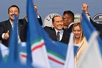 TOPSHOT - (From L) Lega leader Matteo Salvini, Forza Italia leader Silvio Berlusconi and Brothers of Italy leader Giorgia Meloni unite on stage on September 22, 2022 at the end of a joint rally of Italy's right-wing parties Brothers of Italy (Fratelli d'Italia, FdI), the League (Lega) and Forza Italia at Piazza del Popolo in Rome, ahead of the September 25 general election. (Photo by Andreas SOLARO / AFP)