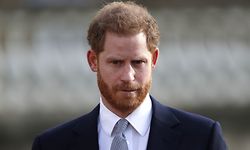 (FILES) In this file photo taken on January 16, 2020, Britain's Prince Harry, Duke of Sussex watches children play rugby league prior to the draw for the Rugby League World Cup 2021 at Buckingham Palace in London. - Britain's Prince Harry expressed "great sadness" on January 19, 202 at the way he and his wife Meghan had to give up their royal titles as part of a separation settlement with the Queen. (Photo by Adrian DENNIS / AFP)