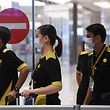 The flight crew of the chartered Scoot airline which flew to Wuhan to evacuate Singaporean nationals arrive at Changi international airport on Singapore on January 30, 2020. - A group of Singaporean nationals evacuated from Wuhan, the Chinese city at the centre of a deadly virus outbreak, arrived in Singapore on January 30 aboard a charter plane. (Photo by Roslan RAHMAN / AFP)