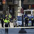 Medical staff members and policemen stand in a cordoned off area after a van ploughed into the crowd, injuring several persons on the Rambla in Barcelona on August 17, 2017.
Police in Barcelona said they were dealing with a "terrorist attack" after a vehicle ploughed into a crowd of pedestrians on the city's famous Las Ramblas boulevard on August 17, 2017. Police were clearing the area after the incident, which has left a number of people injured. / AFP PHOTO / Josep LAGO