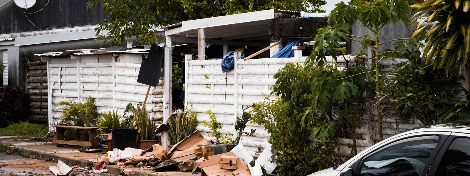 This photograph taken on September 18, 2022 shows the entrance of a home with damaged goods and debris after the passage of Hurricane Fiona in Goyave, on the French island of Guadeloupe. (Photo by Carla Bernhardt / AFP)