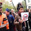 A demonstrator is led away by a policeman as he holds a poster reading 'Stop TTIP - Stop CETA' ahead of an emergency meeting of all Belgium federal entities on the EU-Canada Comprehensive Economic and Trade Agreement (CETA) in Brussels on October 24, 2016. 
The small Belgian region refused on October 24 to bow to growing pressure to back the key trade deal with Canada, heightening tensions within Belgium and Europe as well as with historic allies in North America. Riding a rising wave of Western populist distrust of international trade deals, French-speaking Wallonia's parliament stuck to its refusal to heed a late Monday EU deadline to support the pact.  / AFP PHOTO / EMMANUEL DUNAND