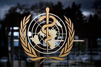 A picture taken on March 9, 2020 shows the sign of the World Health Organization (WHO) at the WHO headquarters in Geneva. - The World Health Organization said on March 9, 2020 that more than 70 percent of those infected with the new coronavirus in China have recovered, adding that the country was "bringing its epidemic under control". (Photo by Fabrice COFFRINI / AFP)