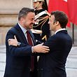 France's President Emmanuel Macron greets Luxembourg's Prime Minister Xavier Bettel (L) at the Palace of Versailles, near Paris, on March 10, 2022, prior to the EU leaders summit to discuss the fallout of Russia's invasion in Ukraine. - EU leaders are scrambling to find ways to urgently address the fallout of Russia's invasion of Ukraine that has imperilled the bloc's economy and exposed a dire need for a stronger defence. (Photo by Ludovic MARIN / AFP)