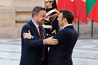 France's President Emmanuel Macron greets Luxembourg's Prime Minister Xavier Bettel (L) at the Palace of Versailles, near Paris, on March 10, 2022, prior to the EU leaders summit to discuss the fallout of Russia's invasion in Ukraine. - EU leaders are scrambling to find ways to urgently address the fallout of Russia's invasion of Ukraine that has imperilled the bloc's economy and exposed a dire need for a stronger defence. (Photo by Ludovic MARIN / AFP)