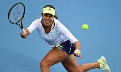 Ana Ivanovic of Serbia hits a return against Timea Bacsinszky of Switzerland during their women's singles semi-final match at the China Open tennis tournament in Beijing on October 10, 2015. AFP PHOTO / GOH CHAI HIN