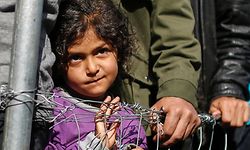 People queue to receive free clothes at a makeshift camp for migrants and refugees at the Greek-Macedonian border near the village of Idomeni, Greece, April 6, 2016. REUTERS/Marko Djurica