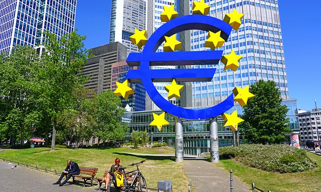 The Euro sculpture monument in front of the Eurotower in Frankfurt, former home of the European Central Bank