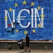 A man collects items for recycling past a political graffiti in Athens, Greece June 30, 2015. The head of the European Commission made a last-minute offer to try to persuade Greek Prime Minister Alexis Tsipras to accept a bailout deal he has rejected before a referendum on Sunday which EU partners say will be a choice of whether to stay in the euro.  The word painted over the European Union flag reads, "No".  REUTERS/Yannis Behrakis      TPX IMAGES OF THE DAY     