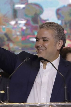 Newly elected Colombian president Ivan Duque celebrates with supporters in Bogota, after winning the presidential runoff election on June 17, 2018.
Conservative Ivan Duque won Colombia's presidential election Sunday after a campaign that turned into a referendum on a landmark 2016 peace deal with FARC rebels, which he pledged to overhaul.
 / AFP PHOTO / Raul Arboleda