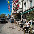 People have lunch at a restaurant in Stockholm on April 22, 2020, during the coronavirus COVID-19 pandemic. (Photo by Jonathan NACKSTRAND / AFP)