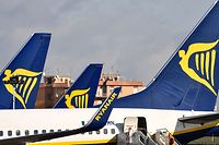 (FILES) In this file photo taken on January 14, 2019 Passenger planes bearing the Ryanair Irish low-cost airline livery, are pictured at Rome's Ciampino airport. - Ryanair said Tuesday, July 16, it will close some of its bases because of problems with Boeing's crisis-hit 737 MAX jet, which has been grounded after two fatal accidents. (Photo by Alberto PIZZOLI / AFP)