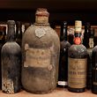 A Douro Port of the 19th century of the antique liquor collection of Bay van der Bunt of the Netherlands is seen in Breda February 16, 2012. The Dutch antique trader is selling his collection of over 5,000 unopened bottles of Cognac and other liquors, which he claims is the biggest of its kind. REUTERS/Michael Kooren (NETHERLANDS - Tags: BUSINESS SOCIETY)