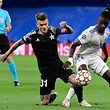 Sheriff's  midfielder Sebastien Thill vies with Real Madrid's French midfielder Eduardo Camavinga (R) during the UEFA Champions League first round group D footbal match between Real Madrid and Sheriff Tiraspol at the Santiago Bernabeu stadium in Madrid, on September 28, 2021. (Photo by JAVIER SORIANO / AFP)