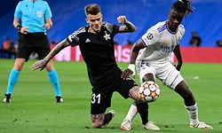 Sheriff's  midfielder Sebastien Thill vies with Real Madrid's French midfielder Eduardo Camavinga (R) during the UEFA Champions League first round group D footbal match between Real Madrid and Sheriff Tiraspol at the Santiago Bernabeu stadium in Madrid, on September 28, 2021. (Photo by JAVIER SORIANO / AFP)