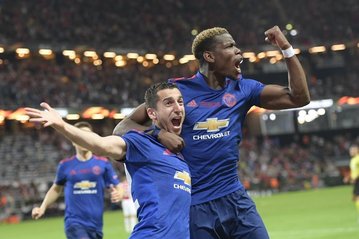 Manchester United's Armenian midfielder Henrikh Mkhitaryan (L) celebrates scoring with Manchester United's French midfielder Paul Pogba during the UEFA Europa League final football match Ajax Amsterdam v Manchester United on May 24, 2017 at the Friends Arena in Solna outside Stockholm. / AFP PHOTO / TT News Agency / Anders WIKLUND