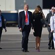 US President Donald Trump and US First Lady Melania Trump walk to board Air Force One before departing from US military Naval Air Station Sigonella following a G7 summit of Heads of State and Government, on May 27, 2017 near Taormina in Sicily. / AFP PHOTO / MANDEL NGAN