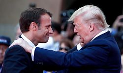 TOPSHOT - US President Donald Trump (R) talks with French President Emmanuel Macron during a French-US ceremony at the Normandy American Cemetery and Memorial in Colleville-sur-Mer, Normandy, northwestern France, on June 6, 2019, as part of D-Day commemorations marking the 75th anniversary of the World War II Allied landings in Normandy. (Photo by Ian LANGSDON / POOL / AFP)