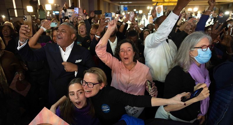 ATLANTA, GEORGIA - DECEMBER 06: Supporters react as they hear the results at an election night watch party for Sen. Raphael Warnock (D-GA) at the Marriott Marquis on December 6, 2022 in Atlanta, Georgia. Sen. Warnock has tonight defeated his Republican challenger Herschel Walker in a runoff election. Win McNamee/Getty Images/AFP (Photo by WIN MCNAMEE / GETTY IMAGES NORTH AMERICA / Getty Images via AFP)