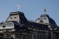 A white flag in flies in the wind atop the Royal Palace in Brussels on March 23, 2020, during a national lockdown in Belgium to curb the spread of COVID-19 (novel coronavirus). (Photo by THIERRY ROGE / BELGA / AFP) / Belgium OUT