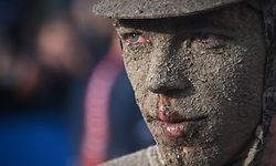 TOPSHOT - AG2R Citroen Team Stan Dewulf from Belgium reacts on the finishing area after competing in the 118th edition of the Paris-Roubaix one-day classic cycling race, between Compiegne and Roubaix, in the Velodrome stadium in Roubaix, northern France, on October 3, 2021. (Photo by Anne-Christine POUJOULAT / POOL / AFP)
