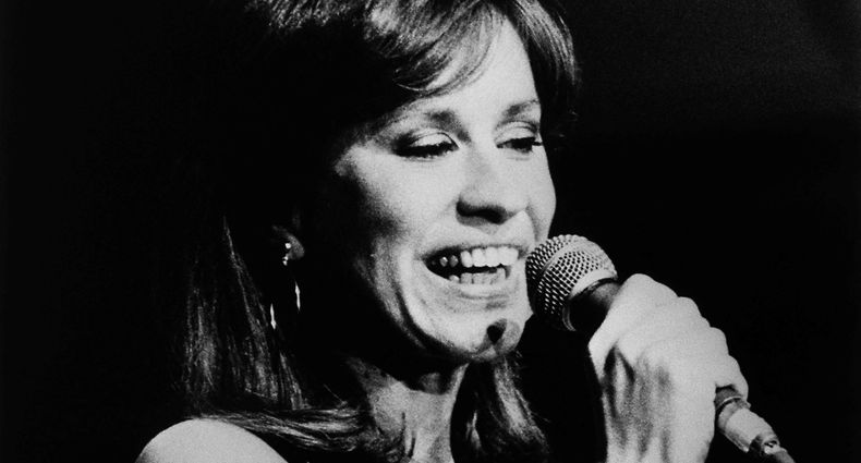 (FILES) Brazilian singer Astrud Gilberto performs on stage during a Jazz Festival on July 16, 1982, at The Hague. Gilberto, the Brazilian singer whose soft, beguiling voice made "The Girl from Ipanema" a worldwide sensation in the 1960s and provided a huge boost to the budding bossa nova genre, has died at age 83, her family said. "I come bearing the sad news that my grandmother became a star today and is next to my grandfather Joao Gilberto," Sofia Gilberto wrote on social media early June 6, 2023. (Photo by P. STOLK / ANP / AFP)