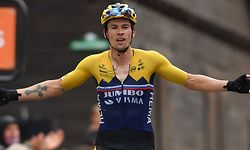 Team Jumbo rider Slovenia's Primoz Roglic celebrates as he crosses the finish line at the end of the second stage of the 72nd edition of the Criterium du Dauphine cycling race, 135 km between Vienne and Col de Porte near Sarcenas on August 13, 2020. (Photo by Justin Setterfield / various sources / AFP)