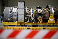 A turbine of the Nord Stream 1 pipeline is pictured on August 3, 2022 at the plant of Siemens Energy in Muelheim an der Ruhr, western Germany, where the engine is stored after maintenance work in Canada. - German Chancellor Olaf Scholz on August 3, 2022 said Russia responsible for blocking the delivery of the turbine it needs to keep gas flowing to Europe. Russian energy giant Gazprom had halted operation of one of the last two operating turbines for the Nord Stream 1 pipeline due to the "technical condition of the engine" and drastically cut gas deliveries to Europe. (Photo by Sascha Schuermann / AFP)