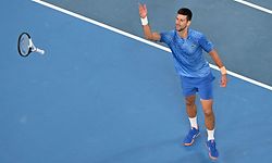 Serbia's Novak Djokovic celebrates his victory against Greece's Stefanos Tsitsipas during the men's singles final on day fourteen of the Australian Open tennis tournament in Melbourne on January 29, 2023. (Photo by Paul CROCK / AFP) / -- IMAGE RESTRICTED TO EDITORIAL USE - STRICTLY NO COMMERCIAL USE --